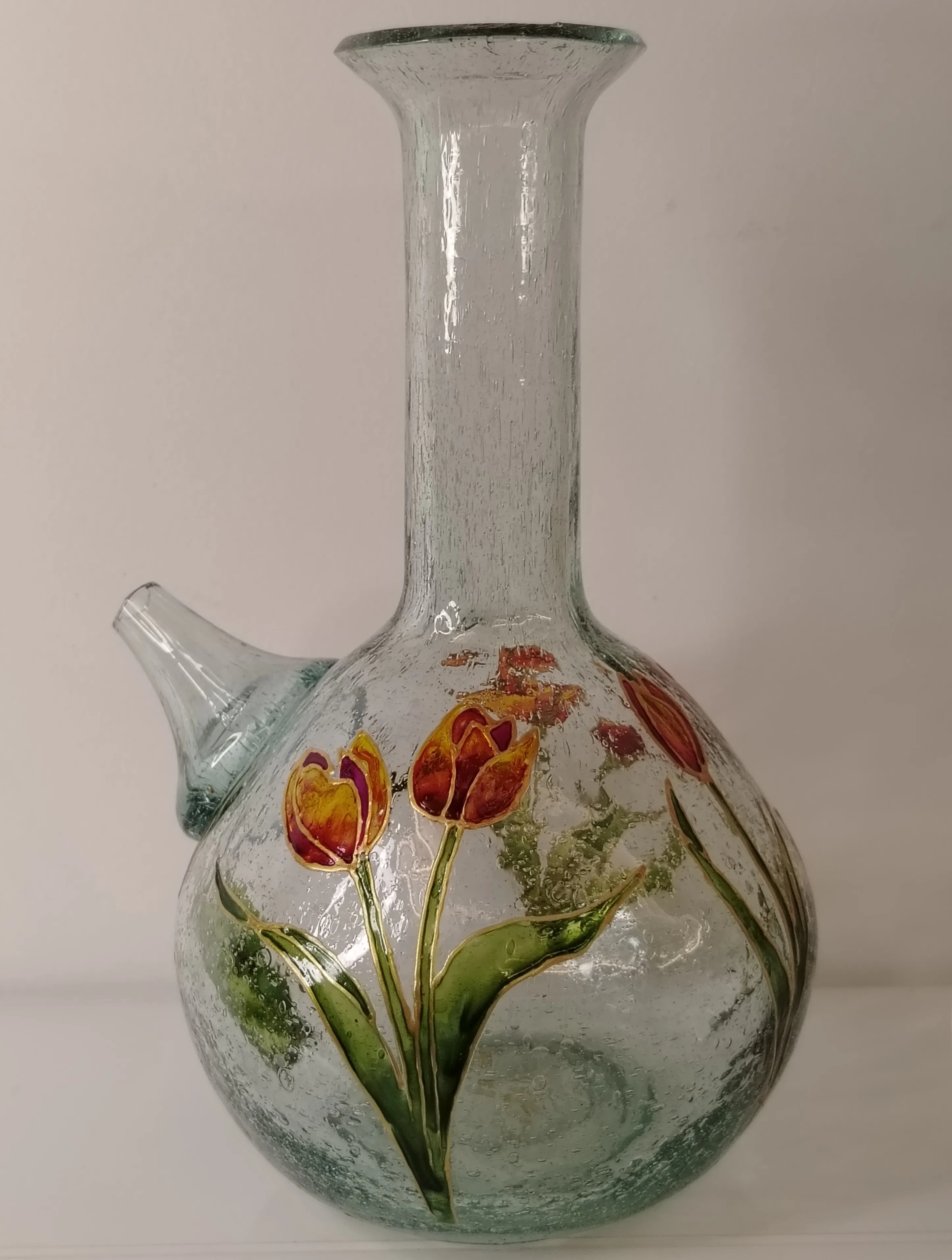 Hand-painted glass jug with a vibrant pink hydrangea bouquet outlined in gold vitrail