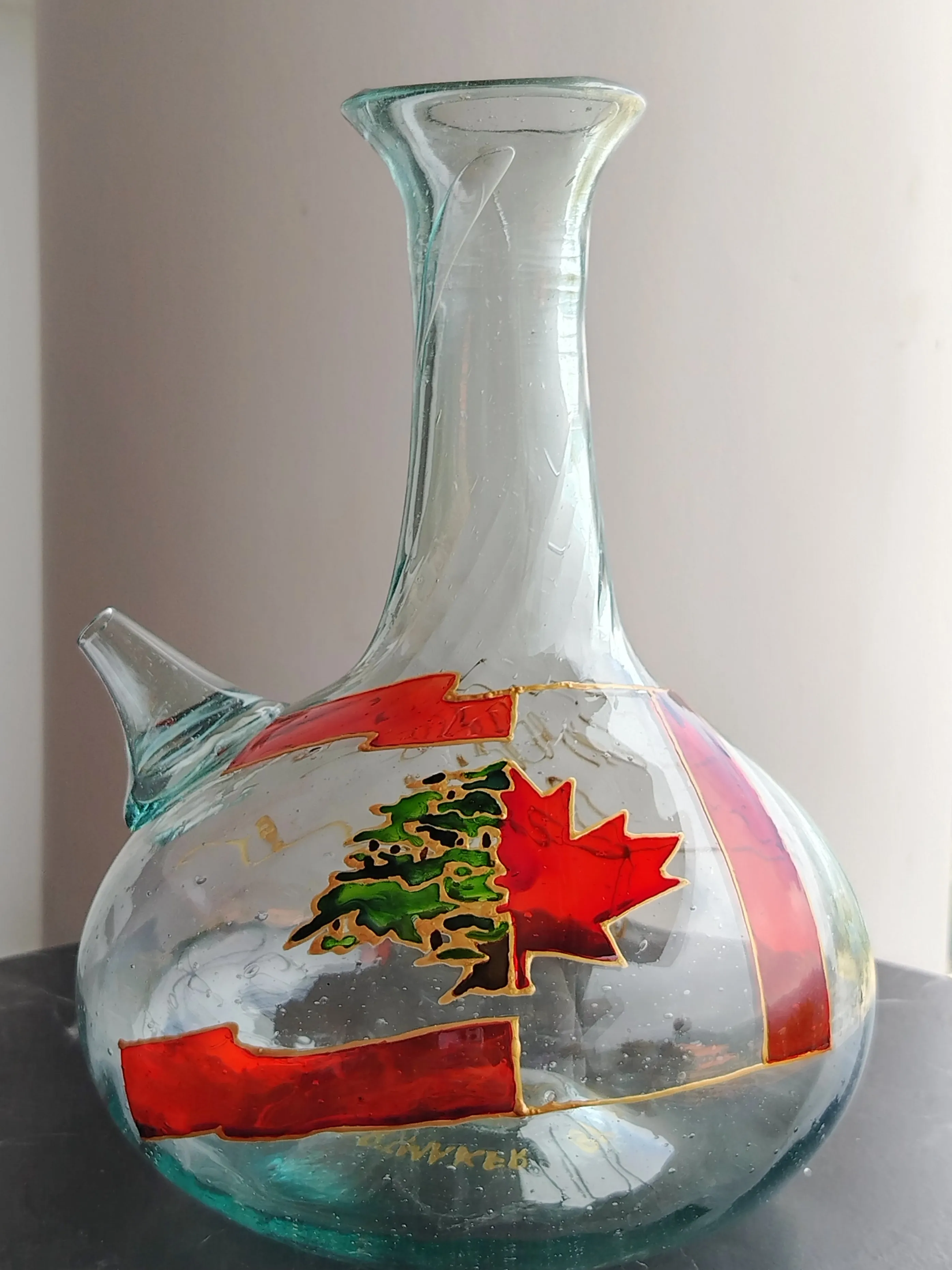 Hand-painted glass jug featuring intertwined Lebanese and Canadian flags with cedar